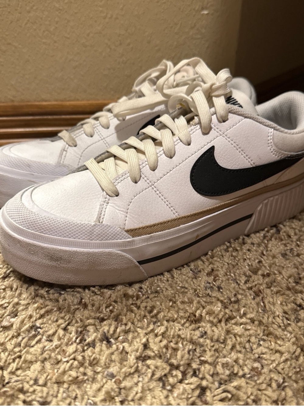Nike White Sneakers with Black Swoosh and Tan Accent